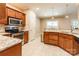 Open kitchen with stainless appliances, granite counters, tile flooring, and lots of storage space at 4203 Flint Dr, Lancaster, SC 29720