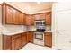 Charming kitchen features stainless appliances, granite counters and backsplash, and wooden cabinetry at 4203 Flint Dr, Lancaster, SC 29720