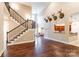 Spacious living room with stairs and access to the kitchen featuring dark wood floors at 4203 Flint Dr, Lancaster, SC 29720