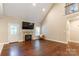 Bright living room with vaulted ceiling, fireplace, and gleaming hardwood floors, perfect for gatherings at 4203 Flint Dr, Lancaster, SC 29720