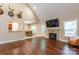 Bright living room flows into the breakfast nook, featuring a fireplace, and hardwood floors at 4203 Flint Dr, Lancaster, SC 29720