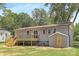 Backyard featuring a wooden deck, green grass, and a shed at 4219 Tipperary Pl, Charlotte, NC 28215