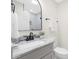Bathroom featuring a gray vanity, modern fixtures, and white ceramic toilet at 4219 Tipperary Pl, Charlotte, NC 28215