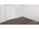 Bright bedroom featuring a closet and hardwood-style flooring at 4219 Tipperary Pl, Charlotte, NC 28215