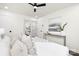 Bedroom featuring white bedding, minimalist decor, and ample closet space at 4219 Tipperary Pl, Charlotte, NC 28215