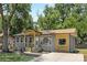 Inviting home with gray siding, a covered porch, and a freshly paved driveway at 4219 Tipperary Pl, Charlotte, NC 28215
