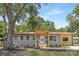 Charming home featuring a covered porch, gray siding, and a well-manicured front yard at 4219 Tipperary Pl, Charlotte, NC 28215