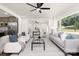 Spacious living area with hardwood floors, an open layout, and natural light at 4219 Tipperary Pl, Charlotte, NC 28215
