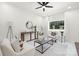 Bright living room featuring neutral tones, modern furnishings, and a view of the outdoors at 4219 Tipperary Pl, Charlotte, NC 28215