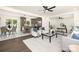 Open-concept living area with hardwood floors, a gray kitchen island, and modern decor at 4219 Tipperary Pl, Charlotte, NC 28215