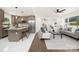 Bright living space featuring an open floor plan, kitchen island, and modern finishes at 4219 Tipperary Pl, Charlotte, NC 28215
