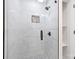 Beautiful walk-in shower with white tile and stylish black hardware at 4219 Tipperary Pl, Charlotte, NC 28215
