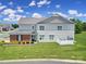 Home boasts a well-manicured lawn and charming exterior features including a brick facade and white trim windows at 44424 Oriole Dr # 200, Indian Land, SC 29707