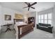 Cozy bedroom with wood furniture, ceiling fan, and natural lighting at 44424 Oriole Dr # 200, Indian Land, SC 29707