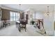 Traditional dining area with plantation shutters, chandelier, and elegant furnishings at 44424 Oriole Dr # 200, Indian Land, SC 29707