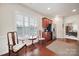 View of the kitchen nook with a window, two chairs, a table, hardwood floors, and access to a stainless refrigerator at 44424 Oriole Dr # 200, Indian Land, SC 29707