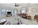 Spacious living room featuring large windows, comfortable seating, and a ceiling fan at 44424 Oriole Dr # 200, Indian Land, SC 29707