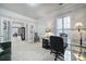 Bright office features large window, glass desk, and is adjacent to dining room at 44424 Oriole Dr # 200, Indian Land, SC 29707
