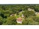 An aerial view showcasing the property’s peaceful setting, surrounded by mature trees that enhance privacy at 509 8Th Avenue Ext, Cramerton, NC 28032