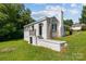 Charming white brick home with a covered back porch and a well-manicured yard at 509 8Th Avenue Ext, Cramerton, NC 28032