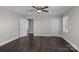 Spacious bedroom featuring hardwood floors, a ceiling fan, and natural light from the window at 509 8Th Avenue Ext, Cramerton, NC 28032