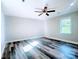 This bedroom features a ceiling fan, large window and modern flooring at 509 8Th Avenue Ext, Cramerton, NC 28032