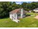 Charming home with white brick exterior, brown roof, green grass and a partially covered porch perfect for relaxing at 509 8Th Avenue Ext, Cramerton, NC 28032