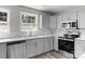 Updated kitchen boasts stainless steel appliances, marble backsplash, lots of natural light, and stylish countertops at 509 8Th Avenue Ext, Cramerton, NC 28032