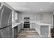 Modern kitchen featuring stainless steel appliances, marble backsplash, light grey cabinets and beautiful countertops at 509 8Th Avenue Ext, Cramerton, NC 28032