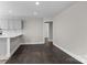Bright living area with hardwood floors and an inviting layout, adjacent to the kitchen and dining spaces at 509 8Th Avenue Ext, Cramerton, NC 28032