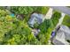 Gorgeous aerial view of a home surrounded by mature trees showcasing the expansive lot and outdoor living spaces at 666 Tryon Pl, Gastonia, NC 28054