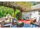 A covered patio features outdoor seating with a stone fireplace at 666 Tryon Pl, Gastonia, NC 28054