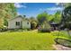 Spacious backyard featuring lush greenery, a firepit, outdoor seating, and a swing at 666 Tryon Pl, Gastonia, NC 28054