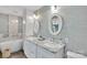Bright bathroom showcasing double marble vanity, oval mirrors, and a modern soaking tub at 666 Tryon Pl, Gastonia, NC 28054