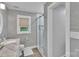Stylish bathroom with a glass-enclosed shower, marble countertop vanity, and modern fixtures at 666 Tryon Pl, Gastonia, NC 28054
