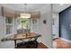 Cozy breakfast nook with bench seating, natural light, and a view of the backyard at 666 Tryon Pl, Gastonia, NC 28054