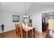 Elegant dining room with hardwood floors and wainscoting, perfect for Gathering gatherings and entertaining guests at 666 Tryon Pl, Gastonia, NC 28054