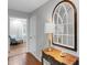 Welcoming entryway featuring hardwood floors, a decorative mirror, and an accent table at 666 Tryon Pl, Gastonia, NC 28054