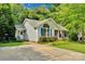 Inviting home with blue shutters, a well-manicured lawn, and a long driveway at 666 Tryon Pl, Gastonia, NC 28054