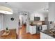 Open kitchen with stainless steel appliances, white cabinets, and seamless flow to adjacent living areas at 666 Tryon Pl, Gastonia, NC 28054