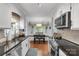 Modern kitchen with stainless steel appliances, granite countertops, and a breakfast nook with natural light at 666 Tryon Pl, Gastonia, NC 28054