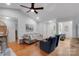 Comfortable living room features hardwood floors, a ceiling fan, and neutral paint for modern comfort at 666 Tryon Pl, Gastonia, NC 28054