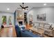 Bright living room features a vaulted ceiling, fireplace, and French doors leading to outdoor living space at 666 Tryon Pl, Gastonia, NC 28054