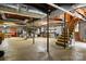 Spacious unfinished basement with exposed ceiling, stairs, and ample storage space at 701 4Th Ne Ave, Conover, NC 28613