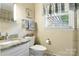 Bright bathroom with granite vanity and natural light at 701 4Th Ne Ave, Conover, NC 28613