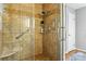 Tiled shower with glass door, shelves and safety bars at 701 4Th Ne Ave, Conover, NC 28613