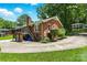 Charming brick home with an elevated deck, lush yard, and spacious driveway at 701 4Th Ne Ave, Conover, NC 28613