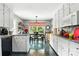 Bright kitchen features white cabinets, granite counters, and a view into the dining area at 701 4Th Ne Ave, Conover, NC 28613