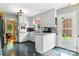 View of the kitchen featuring white cabinets, a peninsula, and an exterior door at 701 4Th Ne Ave, Conover, NC 28613