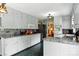 Bright kitchen with white cabinets, granite counters, and stainless steel appliances at 701 4Th Ne Ave, Conover, NC 28613